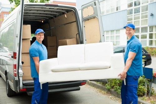Professional movers handling same day removals in Stockwell on a busy street