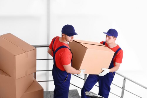 Professional flat removals in Stockwell with a moving van outside an apartment building