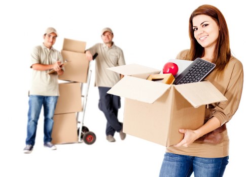 Moving van loading boxes and furniture for a home relocation in Stockwell
