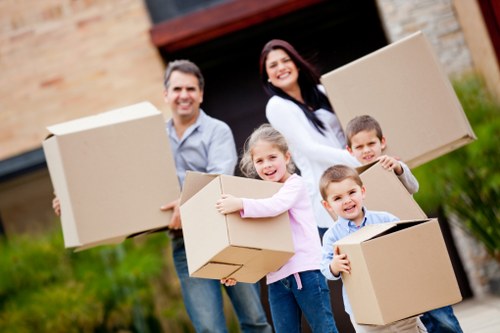 Moving team organizing boxes during a Stockwell home relocation