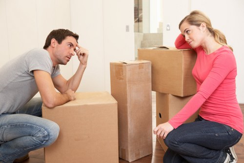 Packed moving boxes and furniture ready for transport in Stockwell
