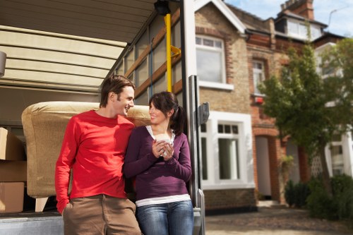 Professional movers handling household furniture in Stockwell